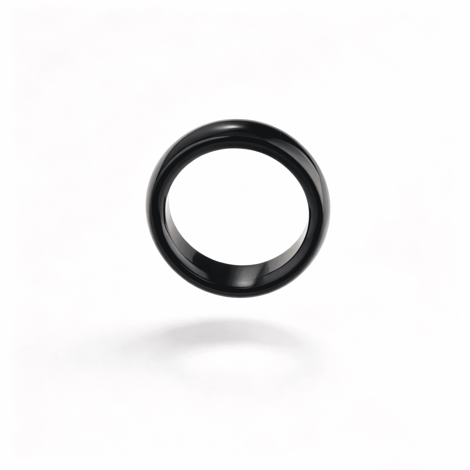 Side view of a slim black chalcedony ring, showcasing its minimalist natural stone design and deep mirror-like luster.