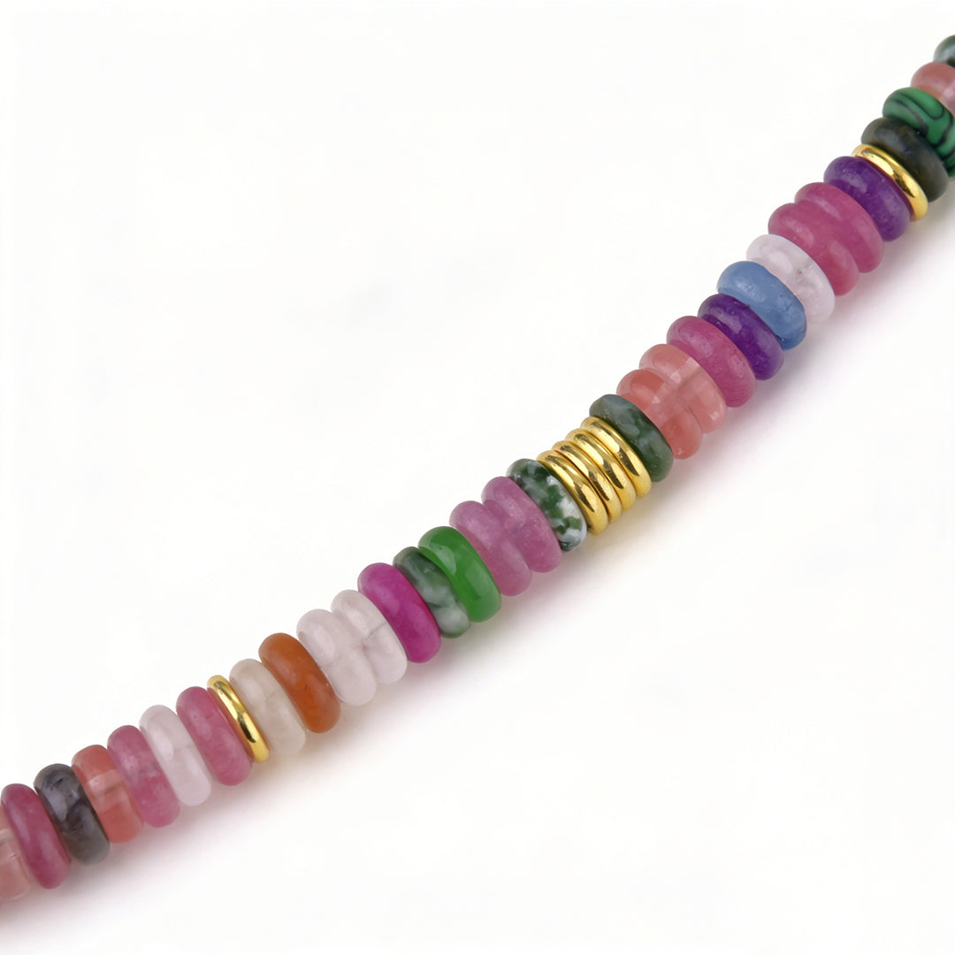 Bohemian chic layered gemstone jewelry styled as a long beaded statement necklace.
