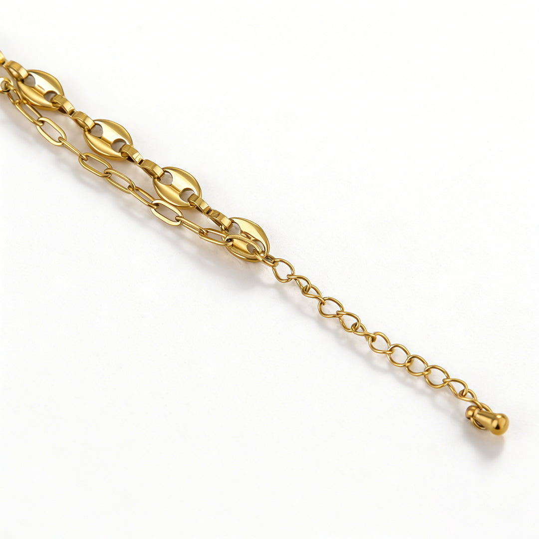 Flat lay of a boho-style gold flower bracelet, highlighting its premium stainless steel jewelry construction.