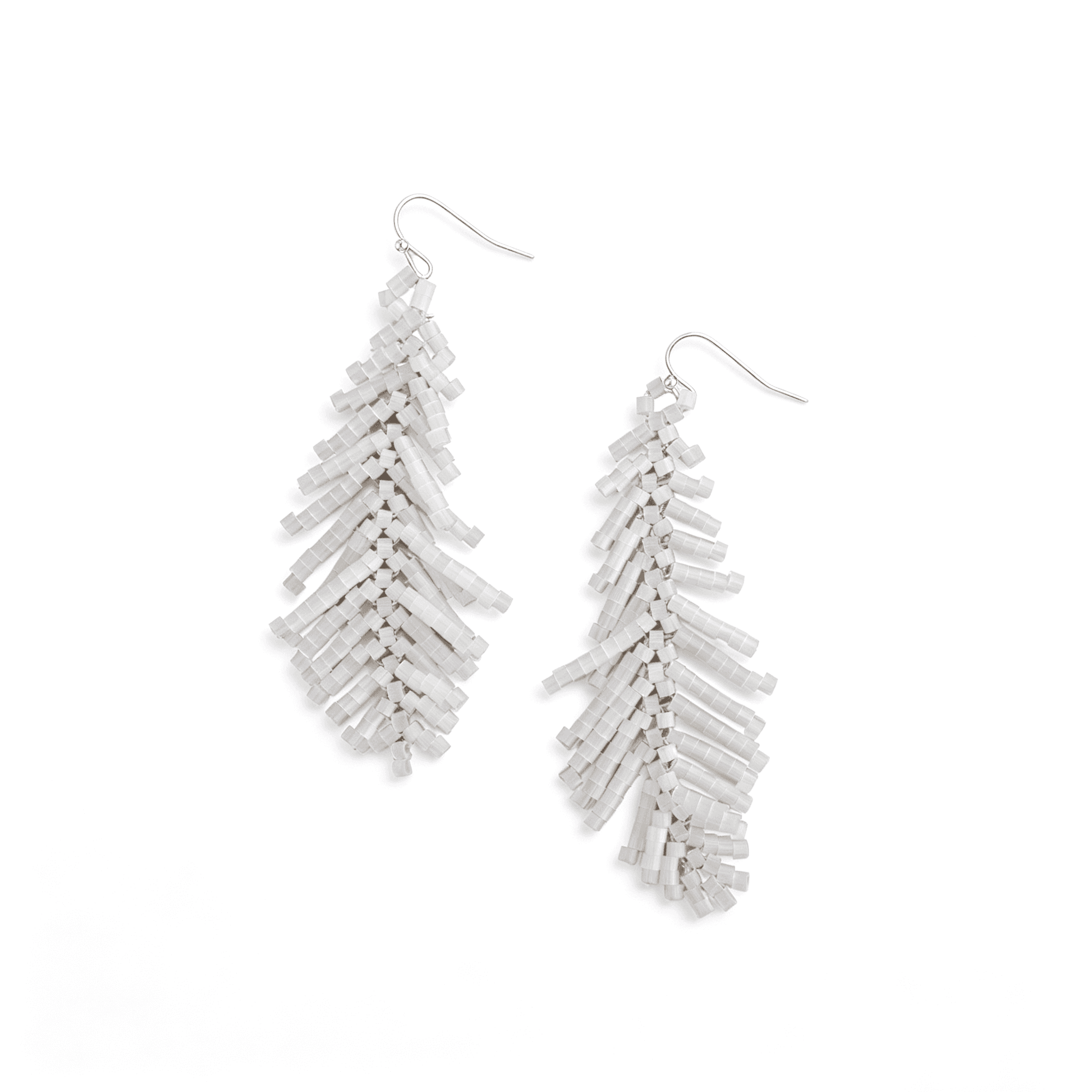 Pair of boho white beaded feather drop earrings in flat lay, showing the intricate hand-woven glass bugle bead leaf structure.