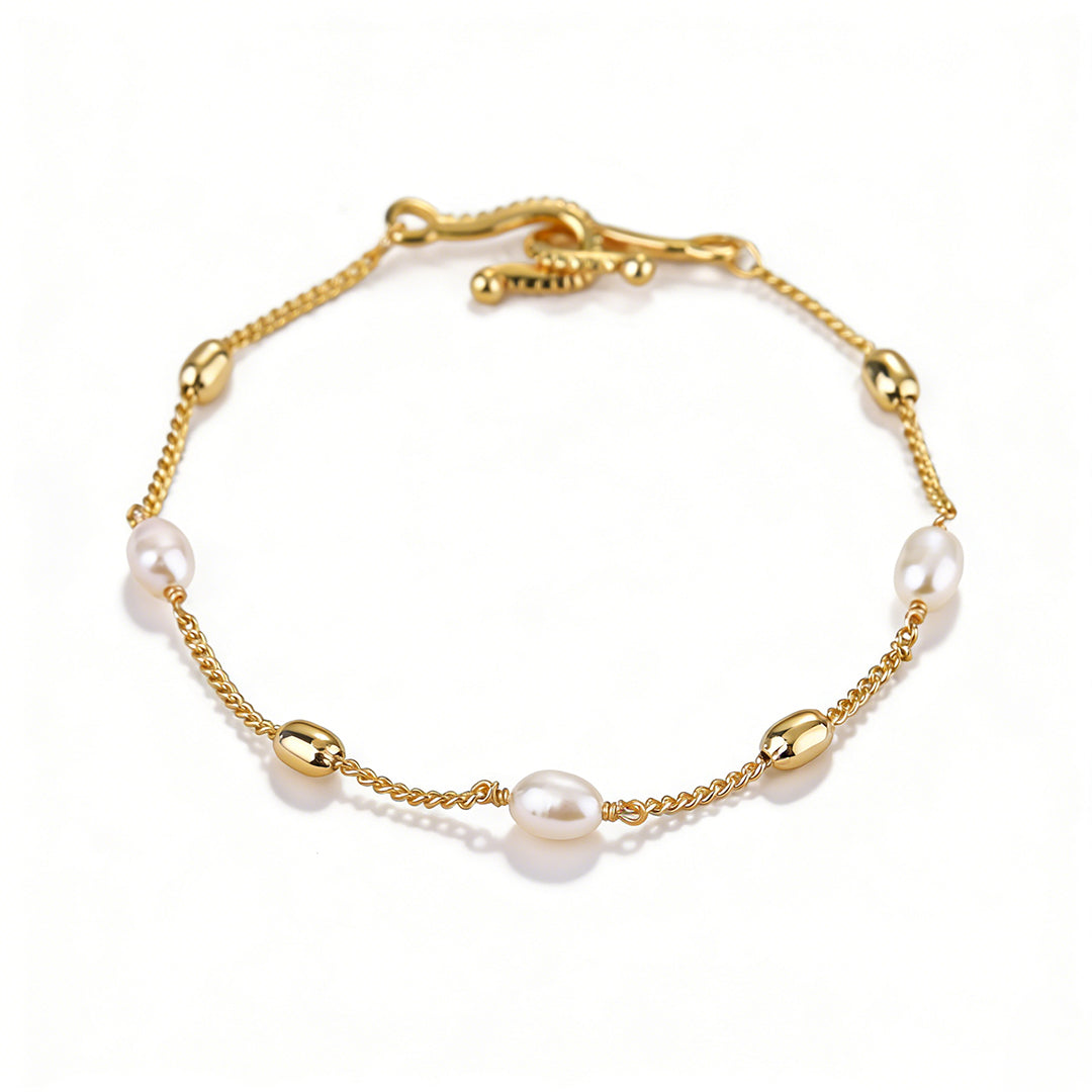 Flat lay of a bold geometric gold link bracelet, tarnish-resistant and lead-free.