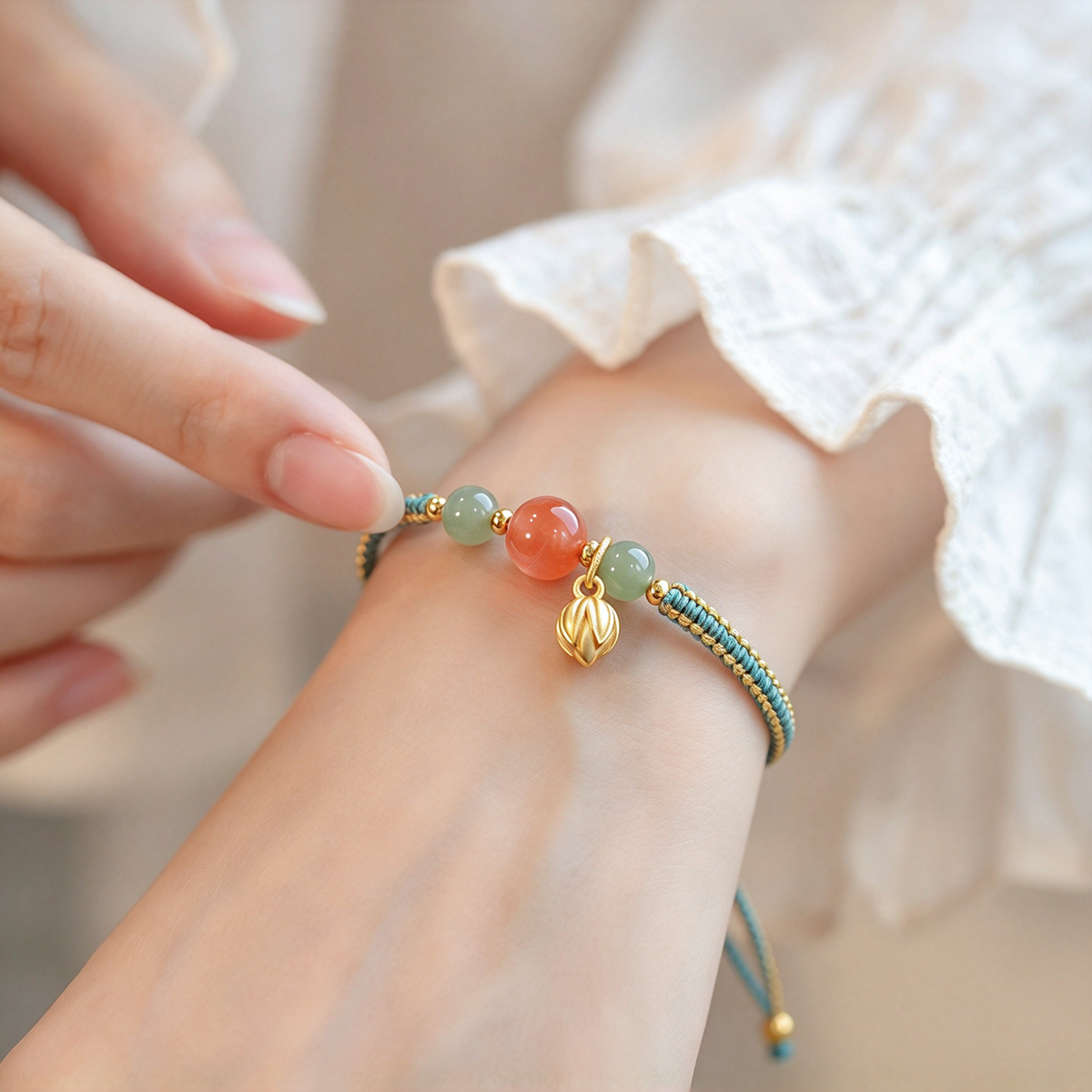 Braided bead bracelet shown on the wrist with its central bead arrangement and charm in focus.
