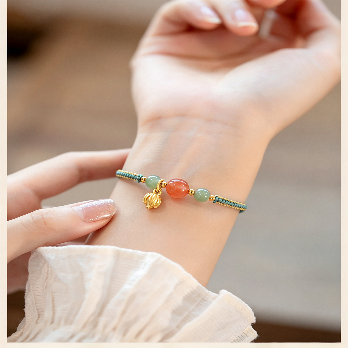 Detail view of the adjustable braided bracelet worn on the wrist, with colorful beads and a dangling charm.