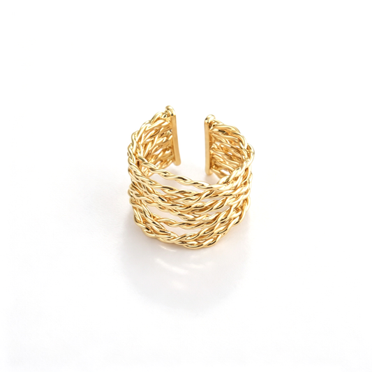 Braided open cuff ring shown from a top view with intertwined bands and open ends