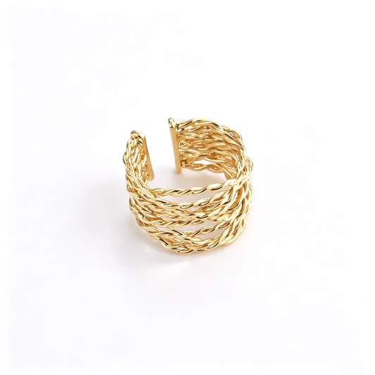 Open cuff ring shown in an angled front view, highlighting its woven band structure