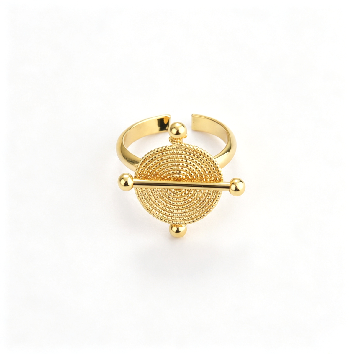 Celestial disc cuff bracelet with a circular centerpiece and horizontal bar detail