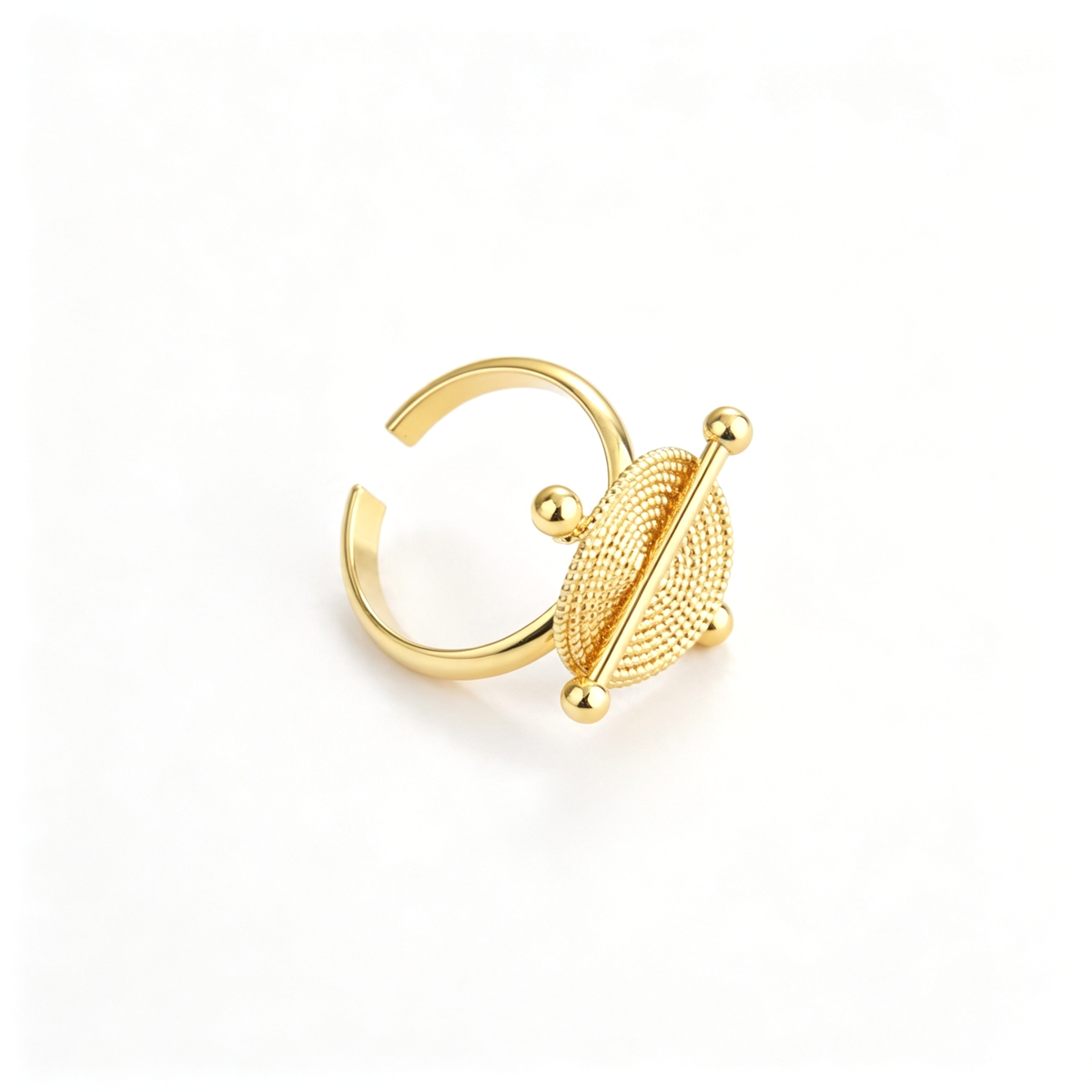 Front view of the cuff bracelet showing the textured circular centerpiece and bar detail