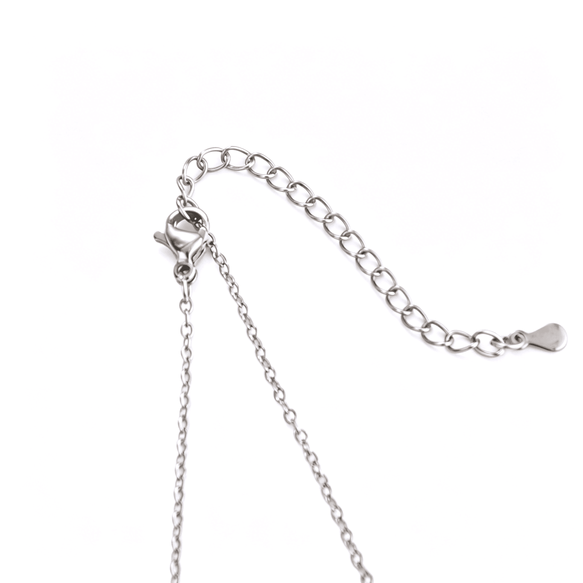 Close-up of the tarnish-resistant silver-plated lobster claw clasp and adjustable chain extender links.