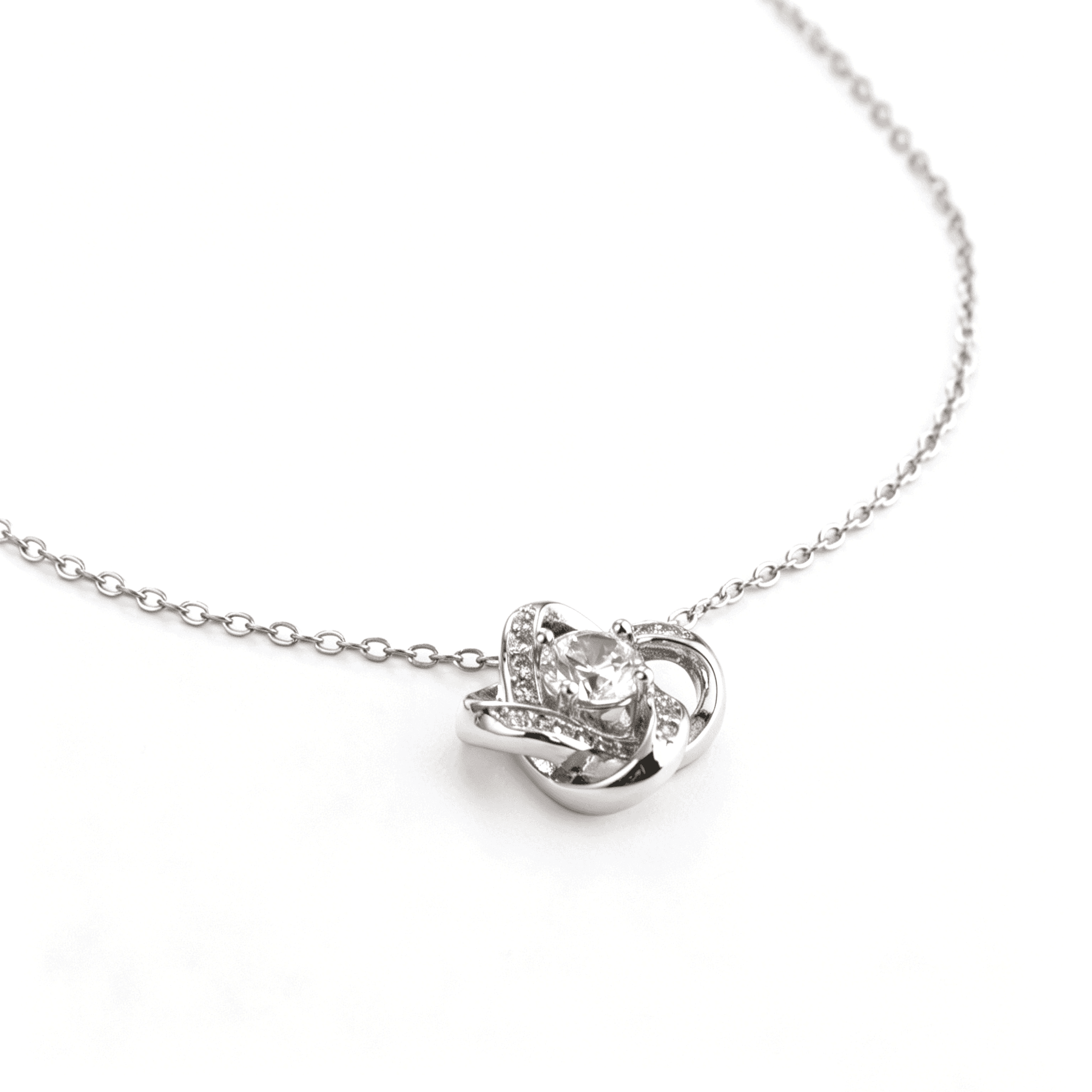 Structural side view of the geometric interlocking silver-plated love knot keepsake necklace.
