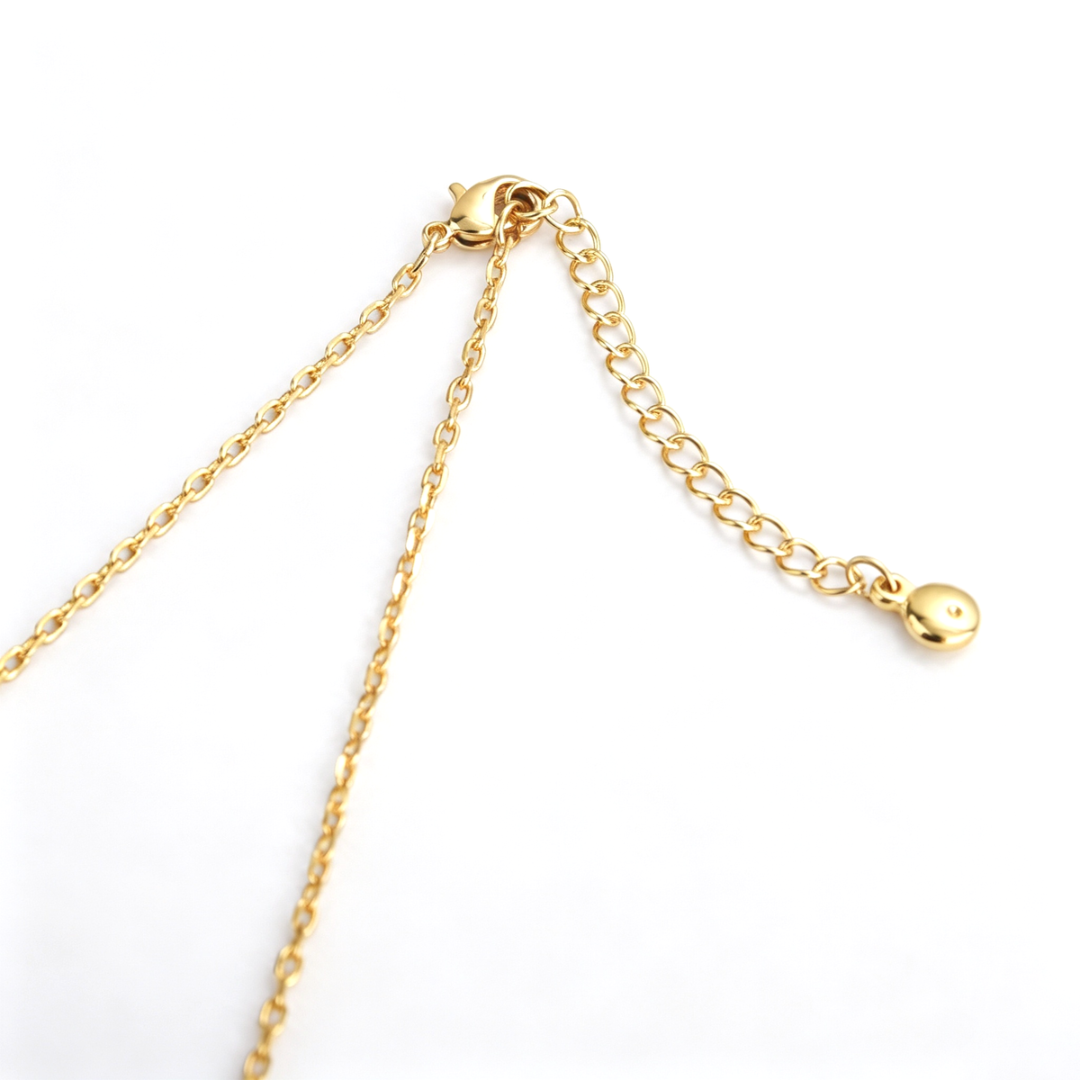 Cross pendant necklace shown from the front with colorful accents arranged across the pendant