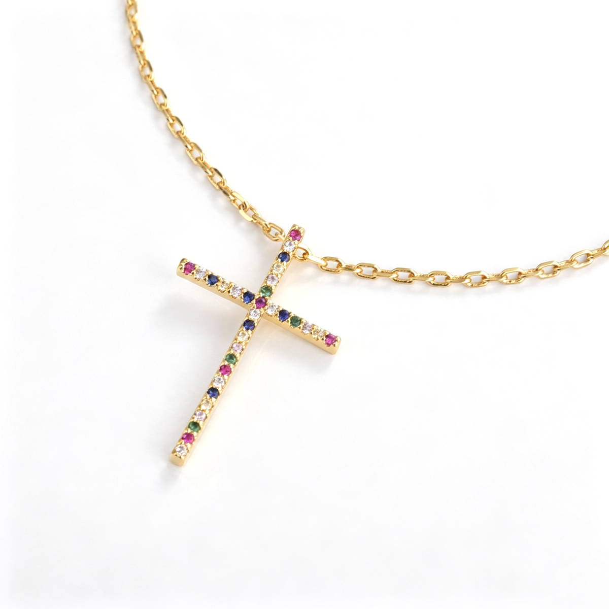 Full view of the cross necklace showing the chain, pendant, clasp, and extension