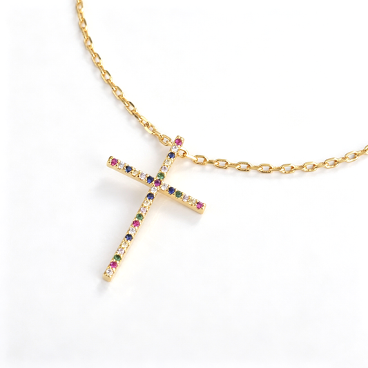 Full view of the cross necklace showing the chain, pendant, clasp, and extension