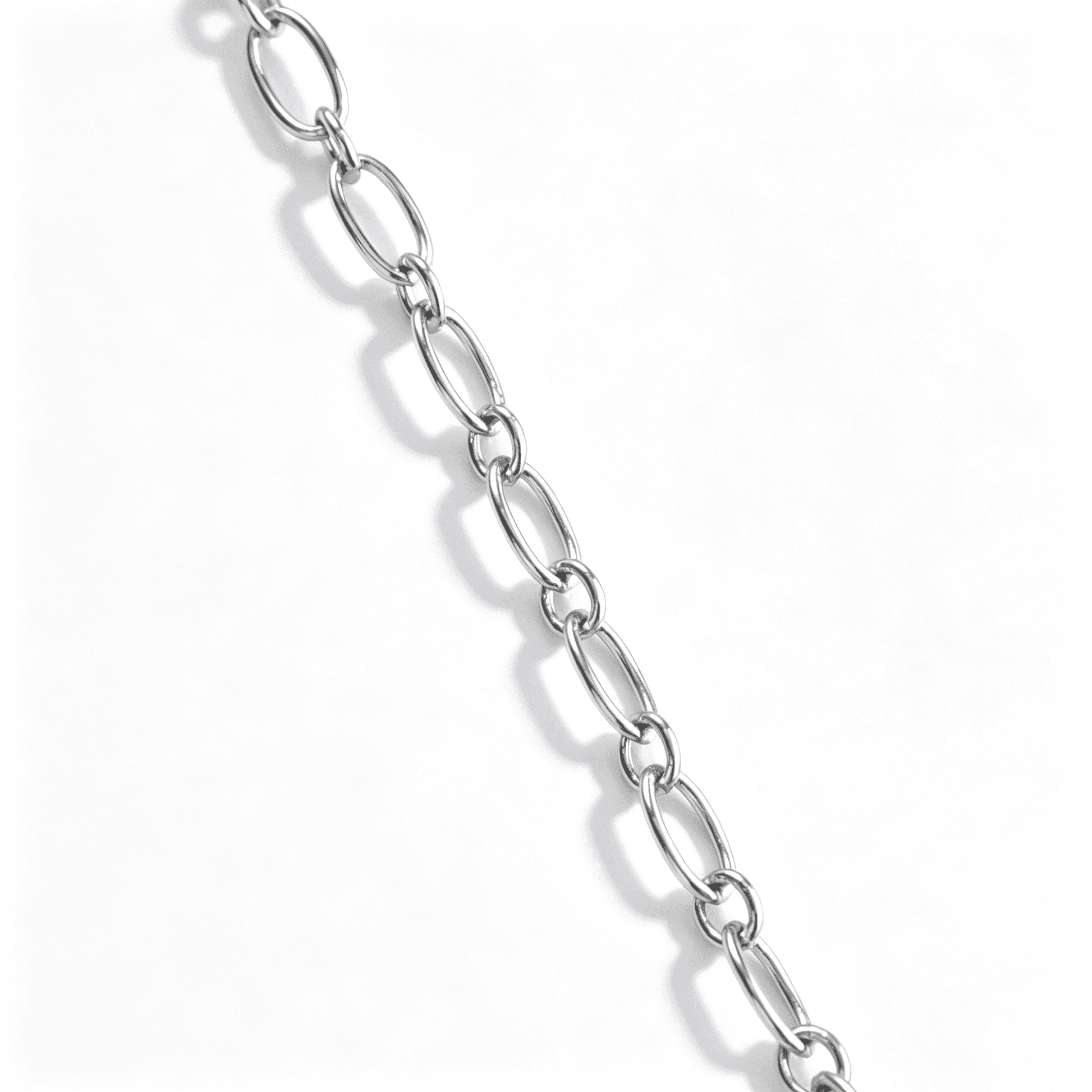 An angled shot of the geometric cross necklace for women, highlighting the polished silver finish.