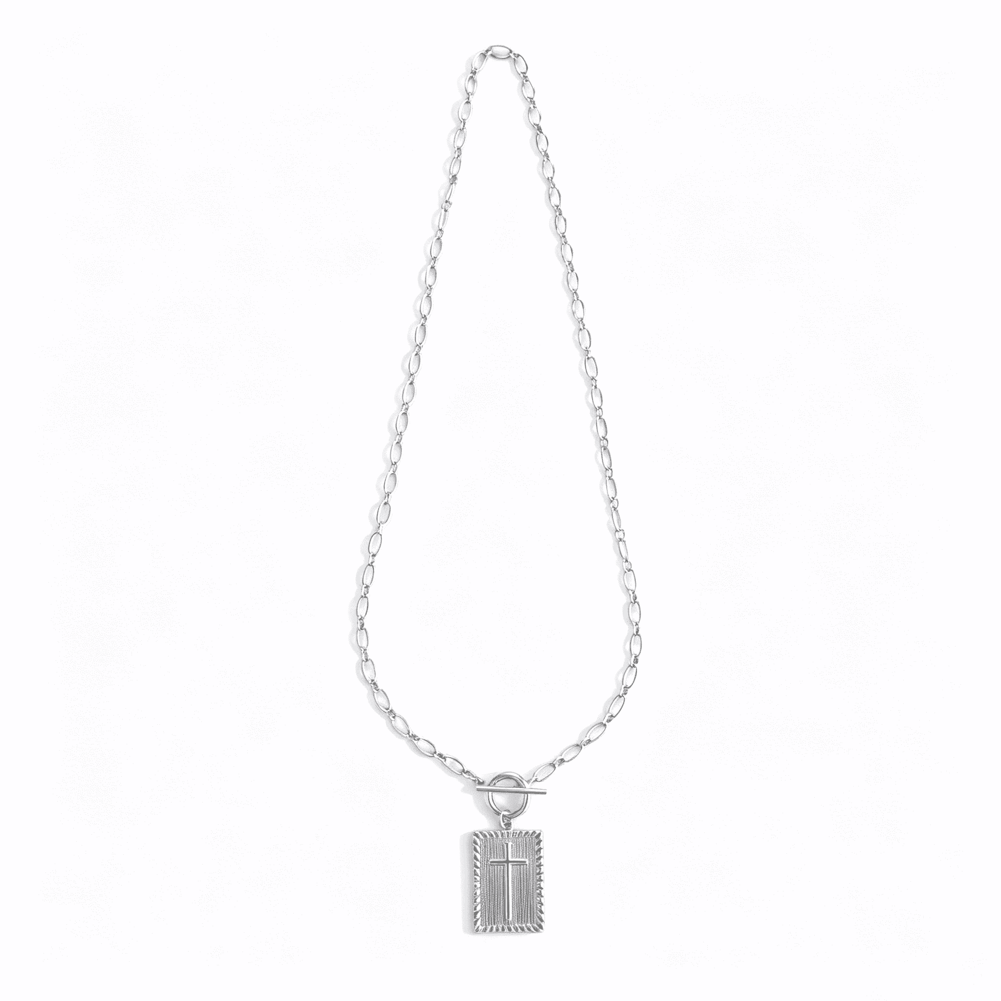 Side profile of a silver cross necklace for women, showcasing the depth of the 3D cube pendant.