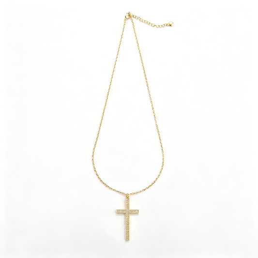Cross pendant necklace shown in a close-up view of the chain and lobster clasp