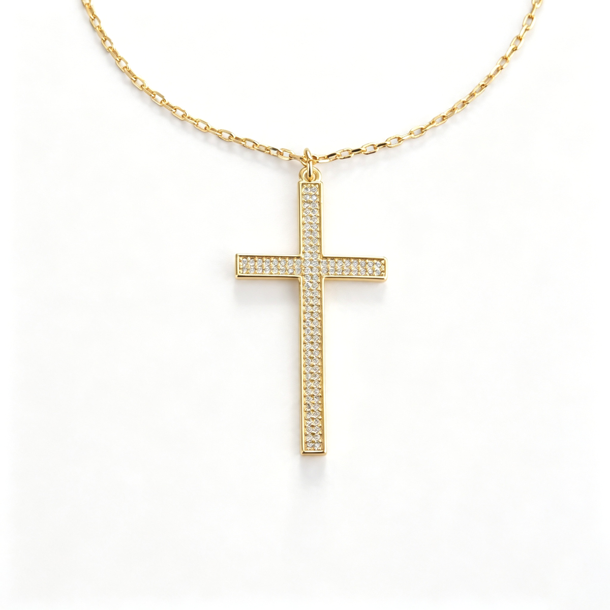 Cross pendant shown at an angled view, highlighting the pendant setting and chain