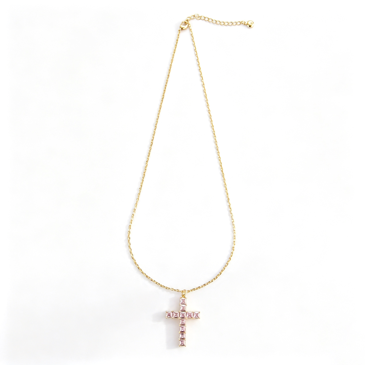 Cross pendant necklace shown in a close-up view of the chain and lobster clasp