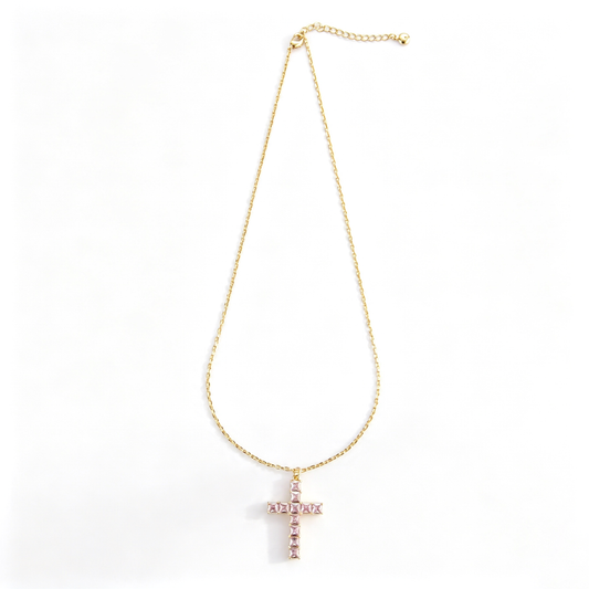 Cross pendant necklace shown in a close-up view of the chain and lobster clasp