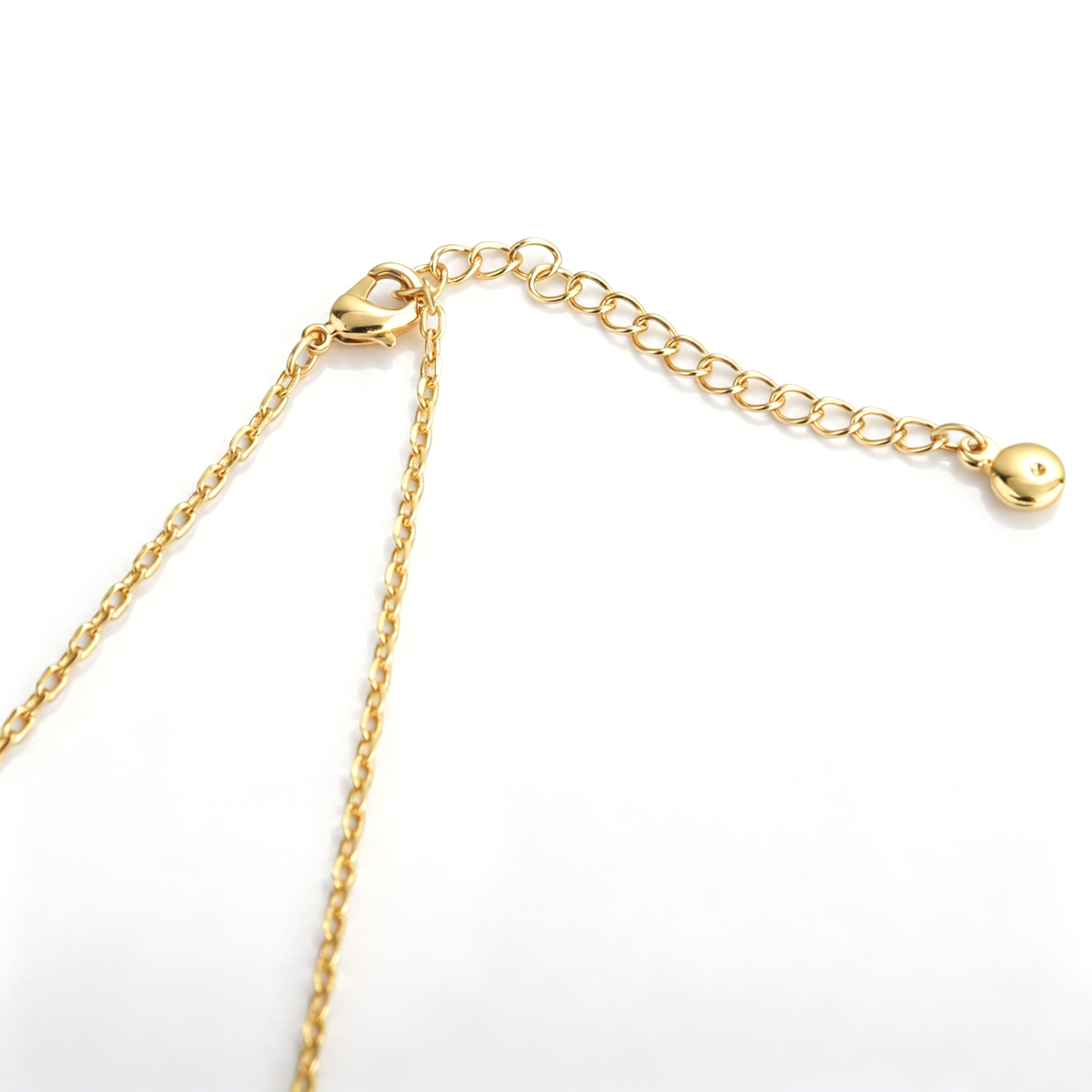Cross pendant necklace shown from the front with the pink-accented cross pendant
