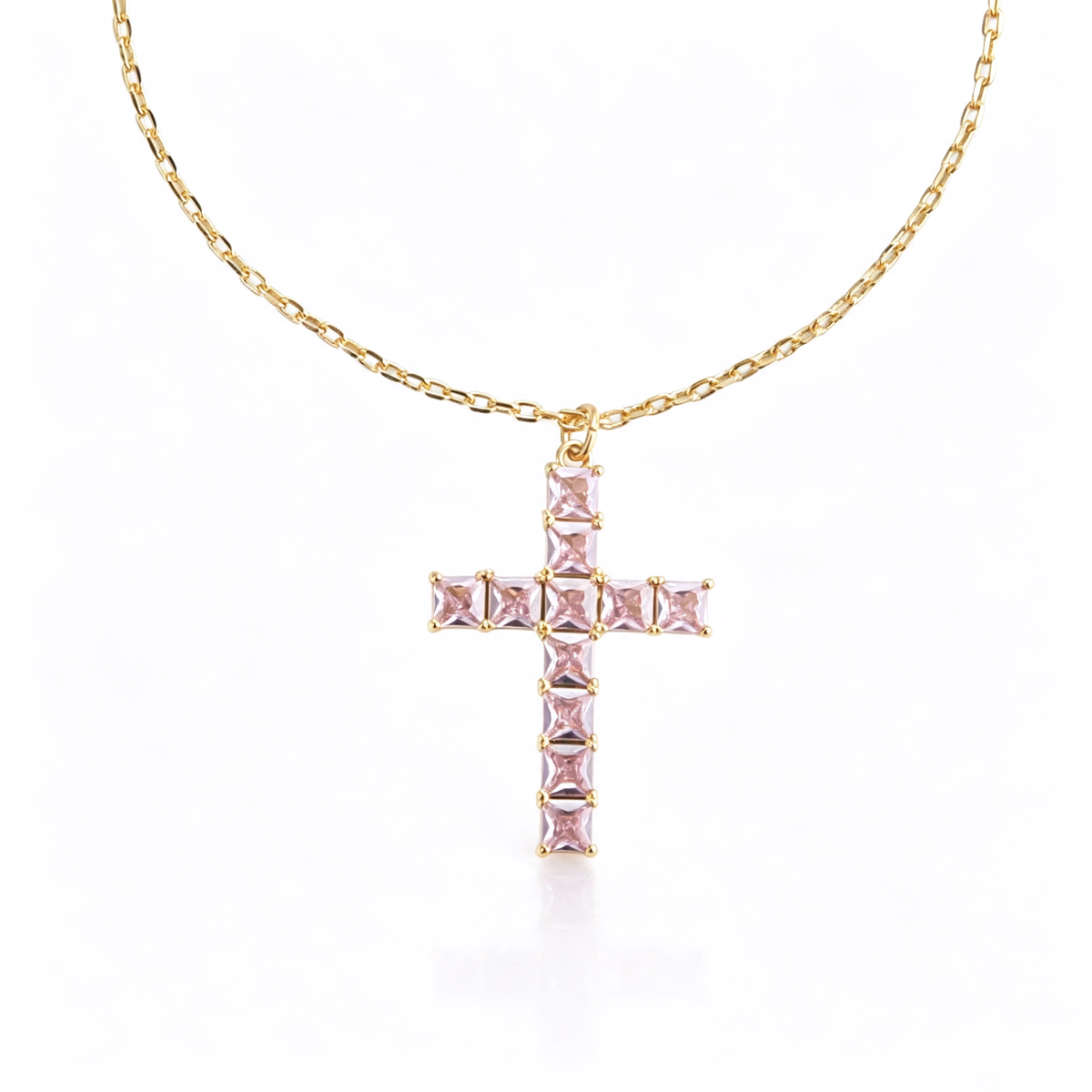 Cross pendant shown at an angled view, highlighting the geometric pendant setting