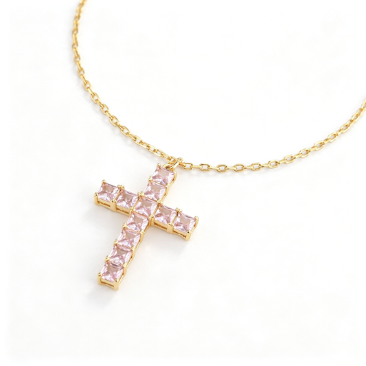 Full view of the cross necklace showing the chain, pendant, and adjustable extension