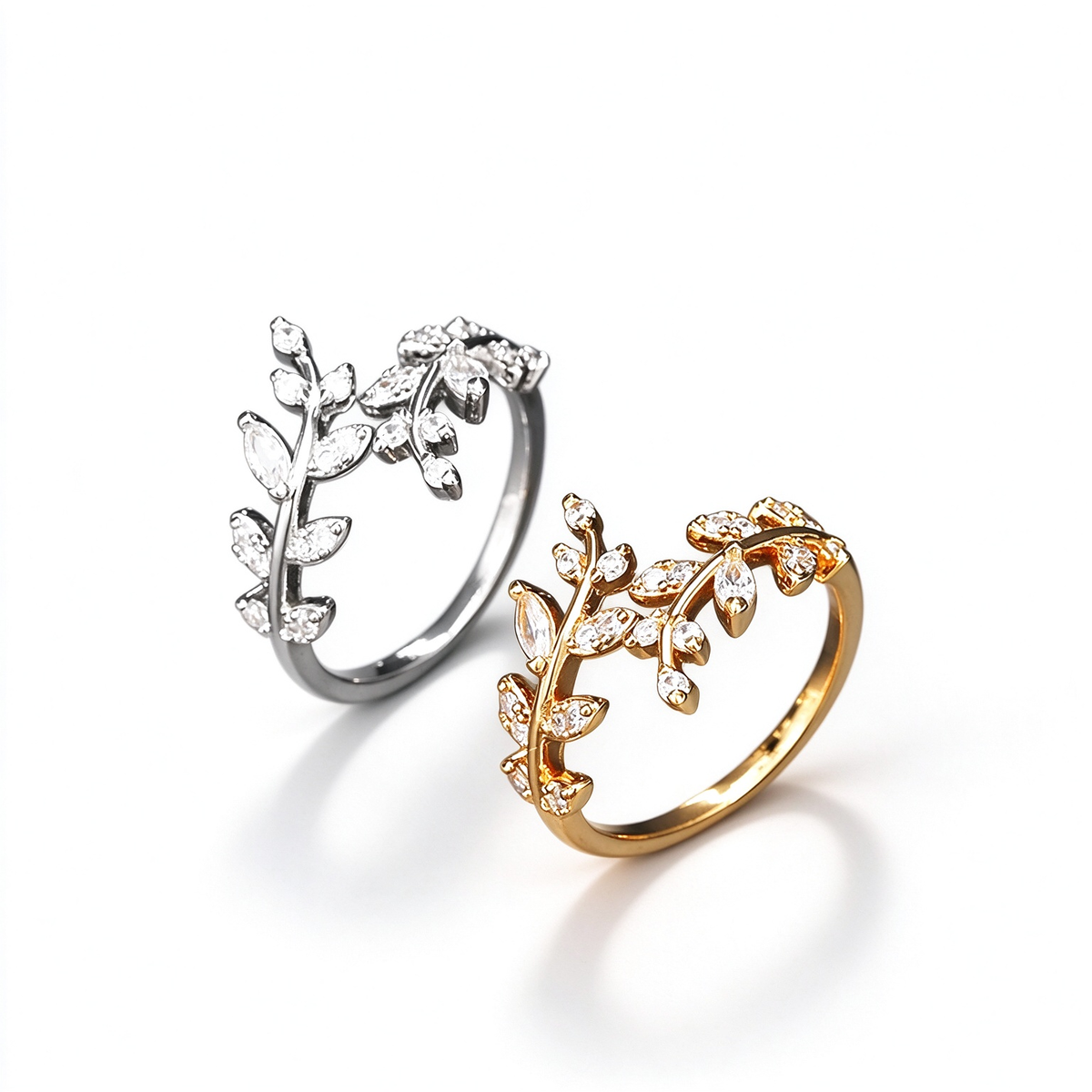 Crystal leaf vine ring shown in gold and silver color options on a white background.