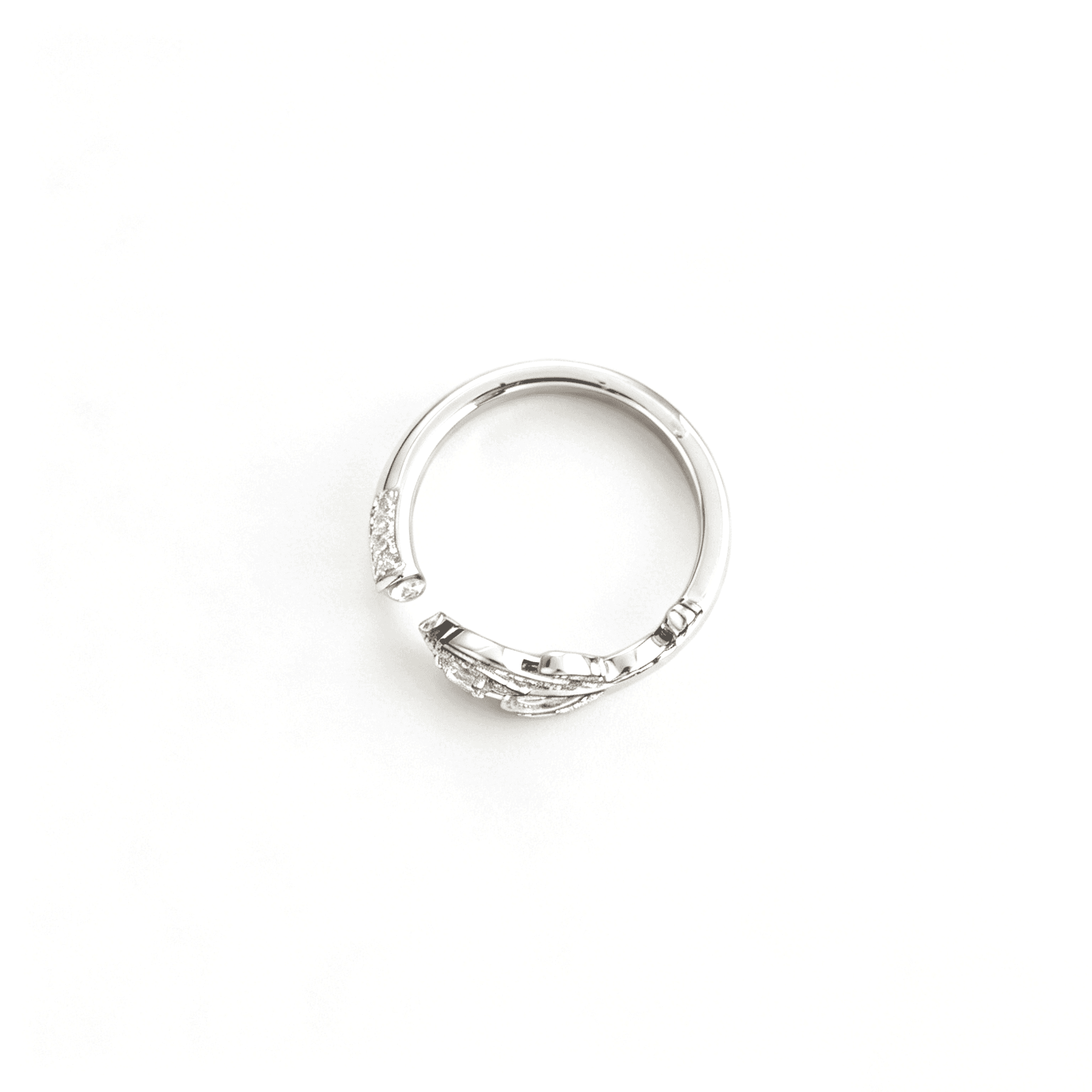 Underneath profile of the open-ended bypass plume ring showing the smooth polished interior band and overlapping wrap style.