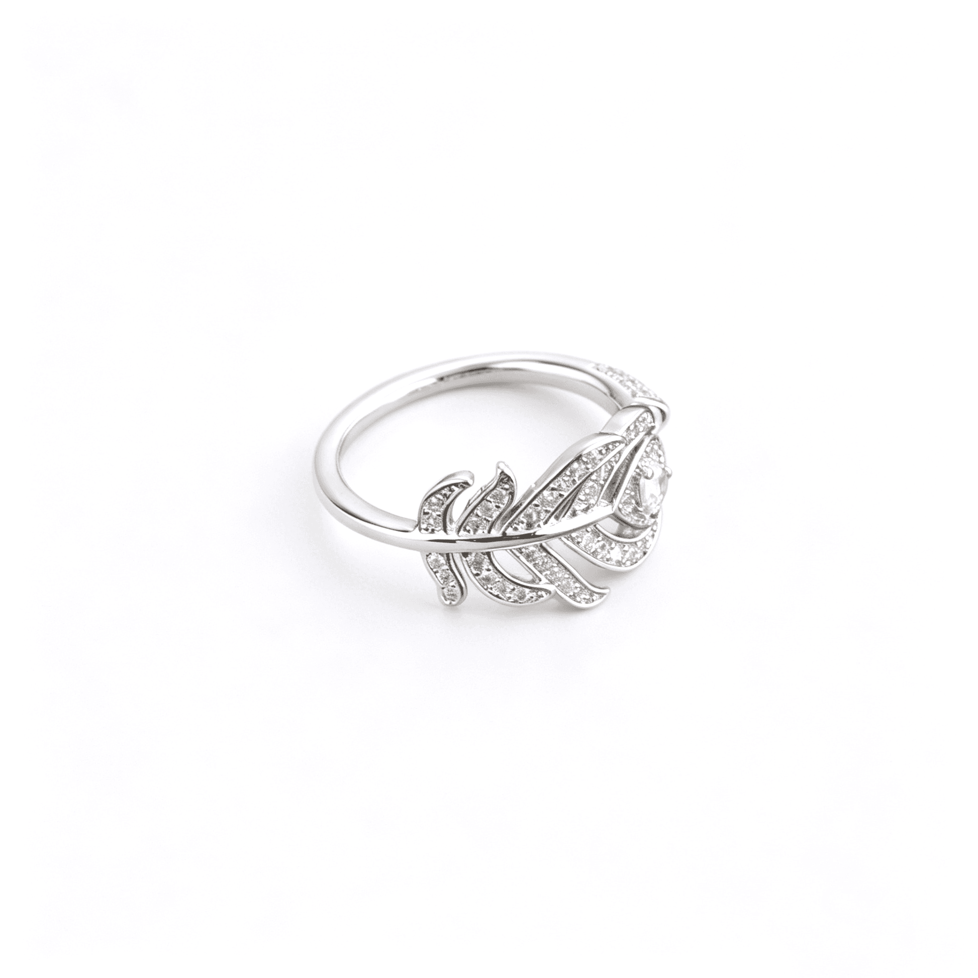 Side detailed view of Ever P. cubic zirconia bypass feather ring showcasing the fluid overlapping botanical lines.