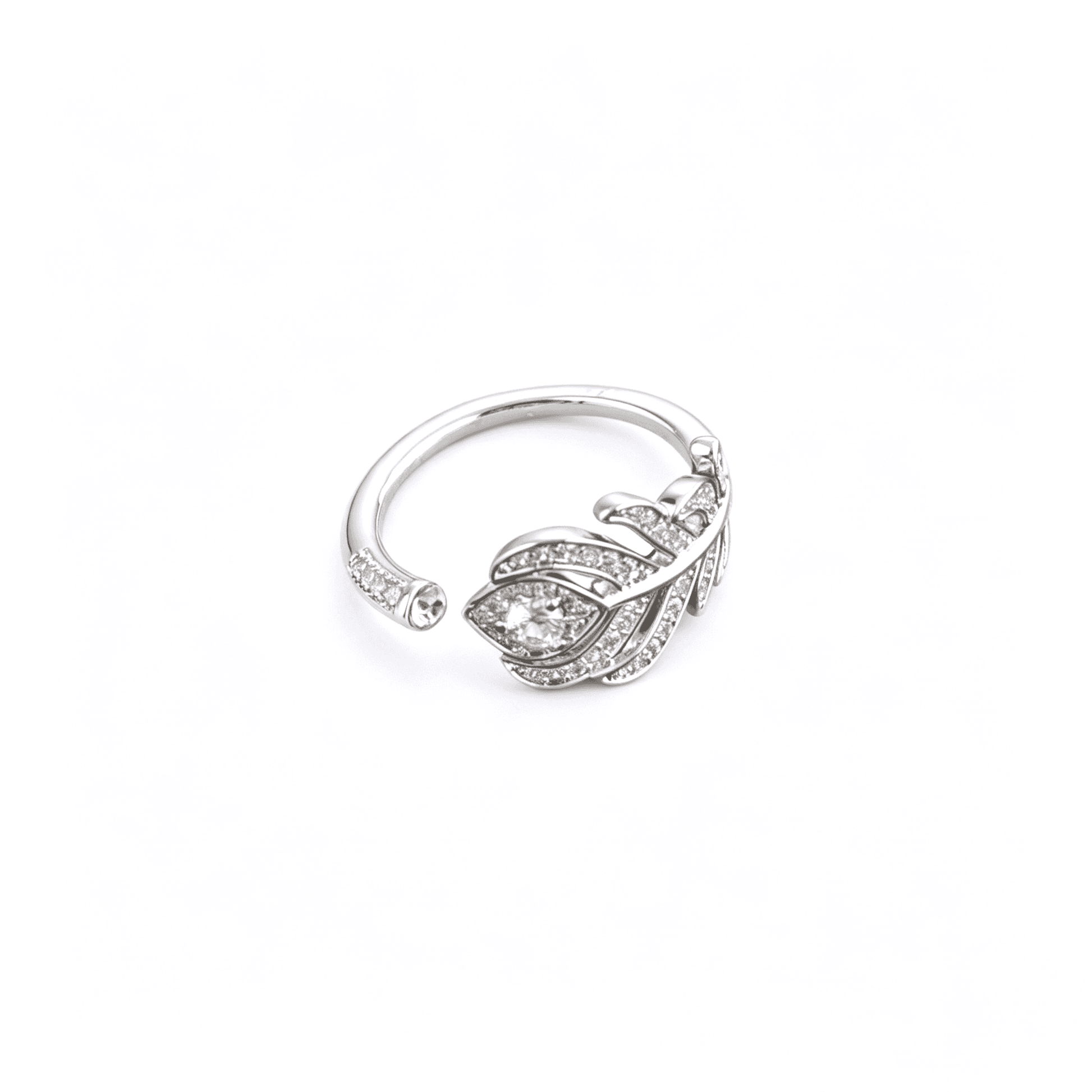 Macro close-up of the feather bypass ring highlighting the brilliant round center stone surrounded by shimmering micro-pave crystals.