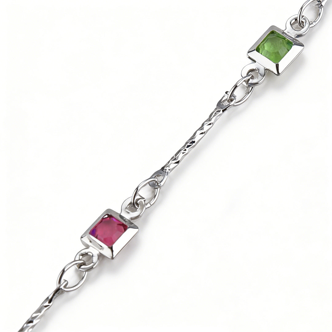 Flat lay of a dainty cubic zirconia bracelet, tarnish-resistant and hypoallergenic, silver-tone jewelry.
