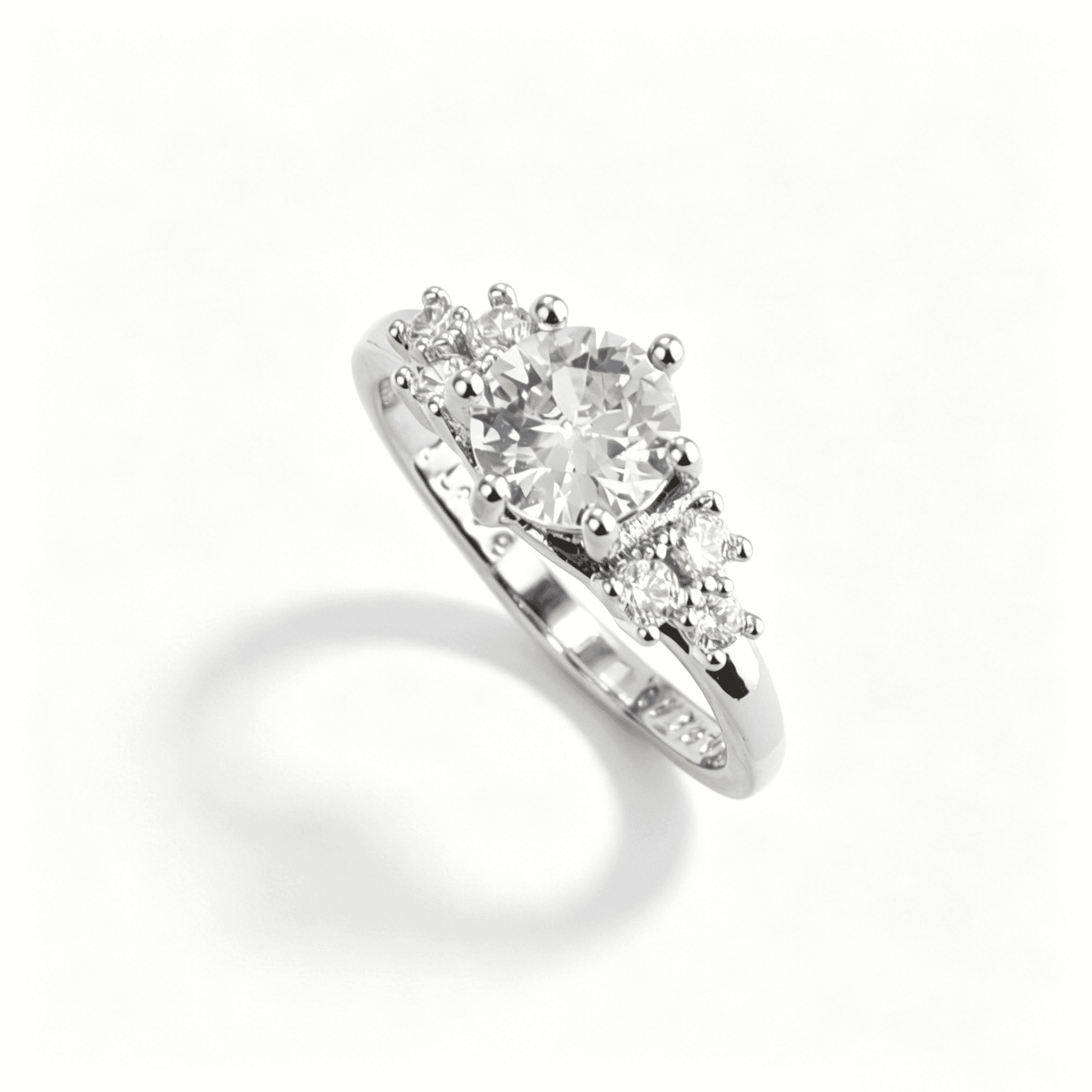 Side view of dainty gold rings stacked together, highlighting the intricate micro pave setting and slim bands.