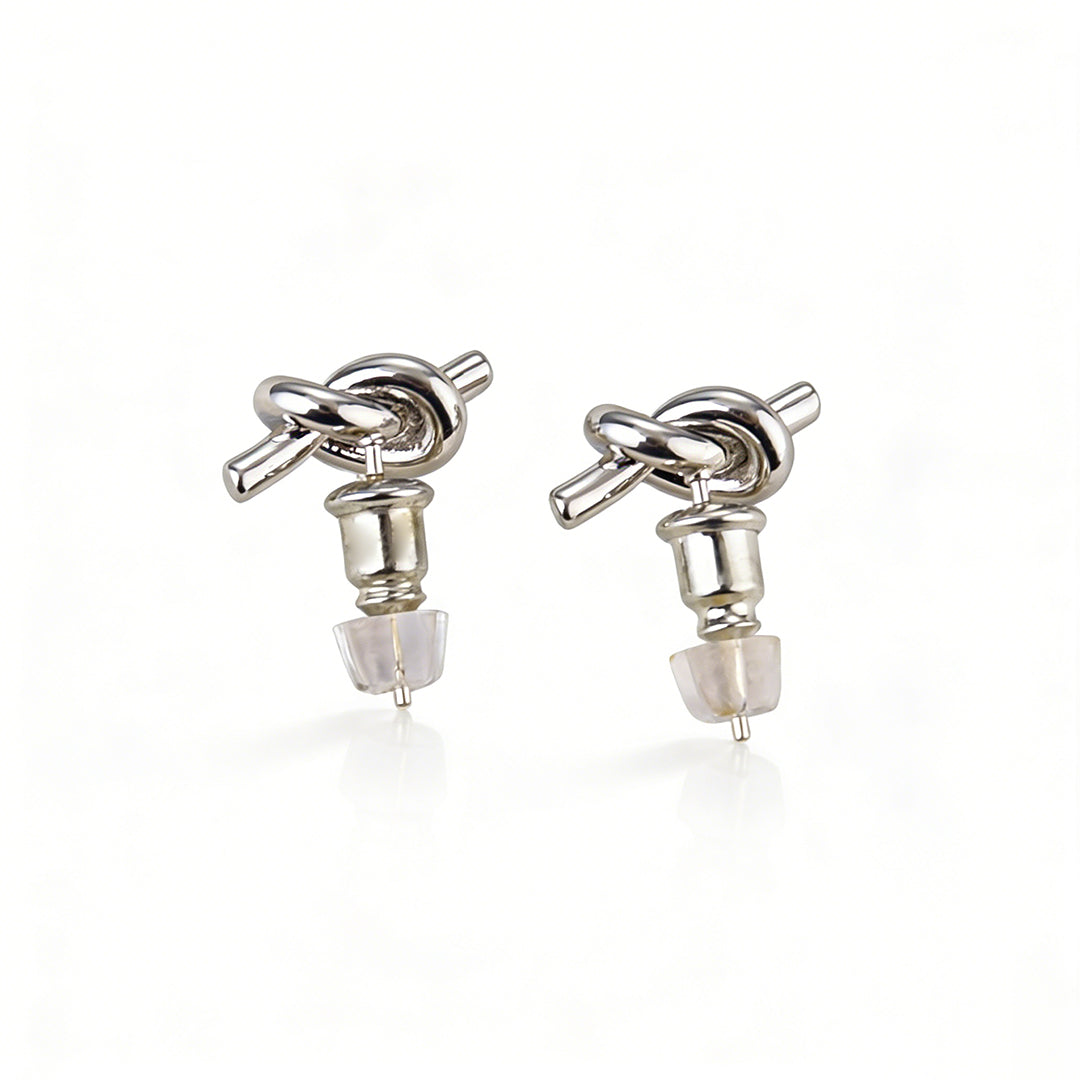 Delicate gold knot studs featuring genuine 925 silver needle posts for a high-quality feel.