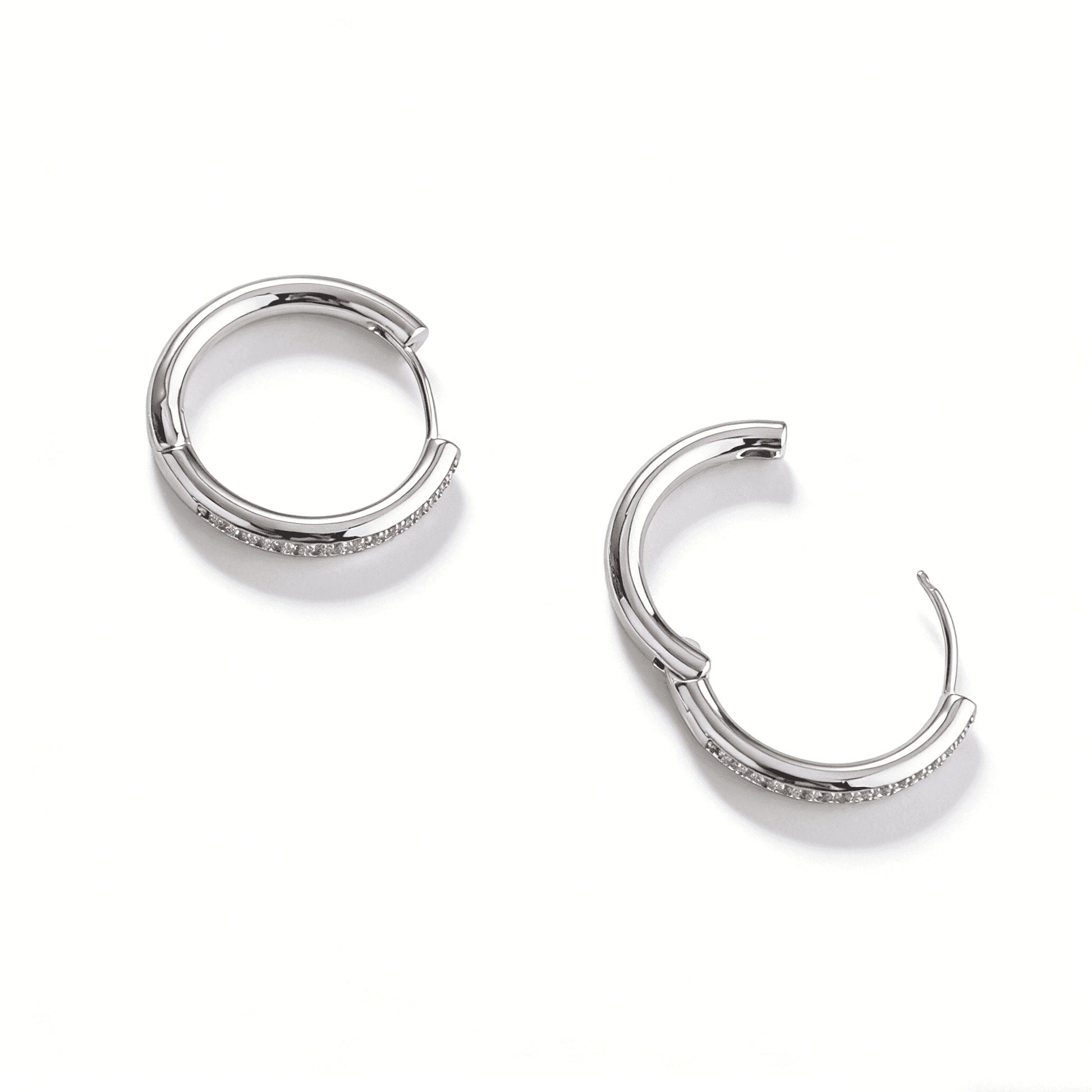 Extreme close-up of the meticulous pave setting on Ever P. medium-sized hoop earrings.