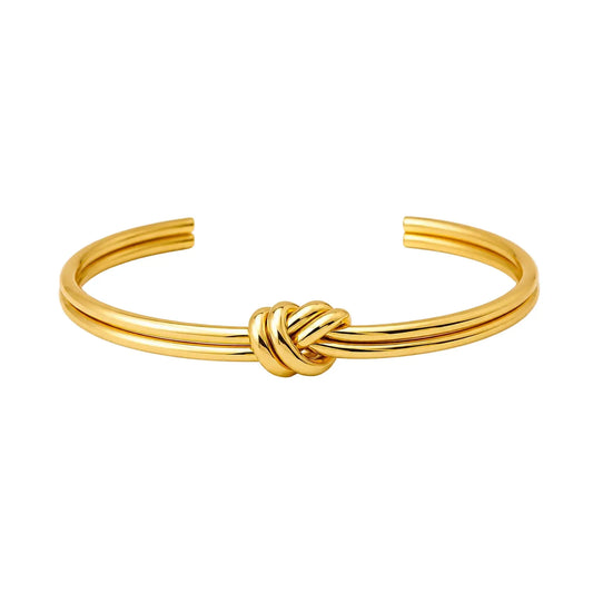 Gold 14K gold-plated stainless steel knot cuff bracelet in a horizontal front view