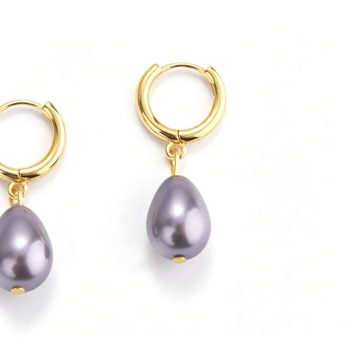 Close-up of purple teardrop accents and round hoop details