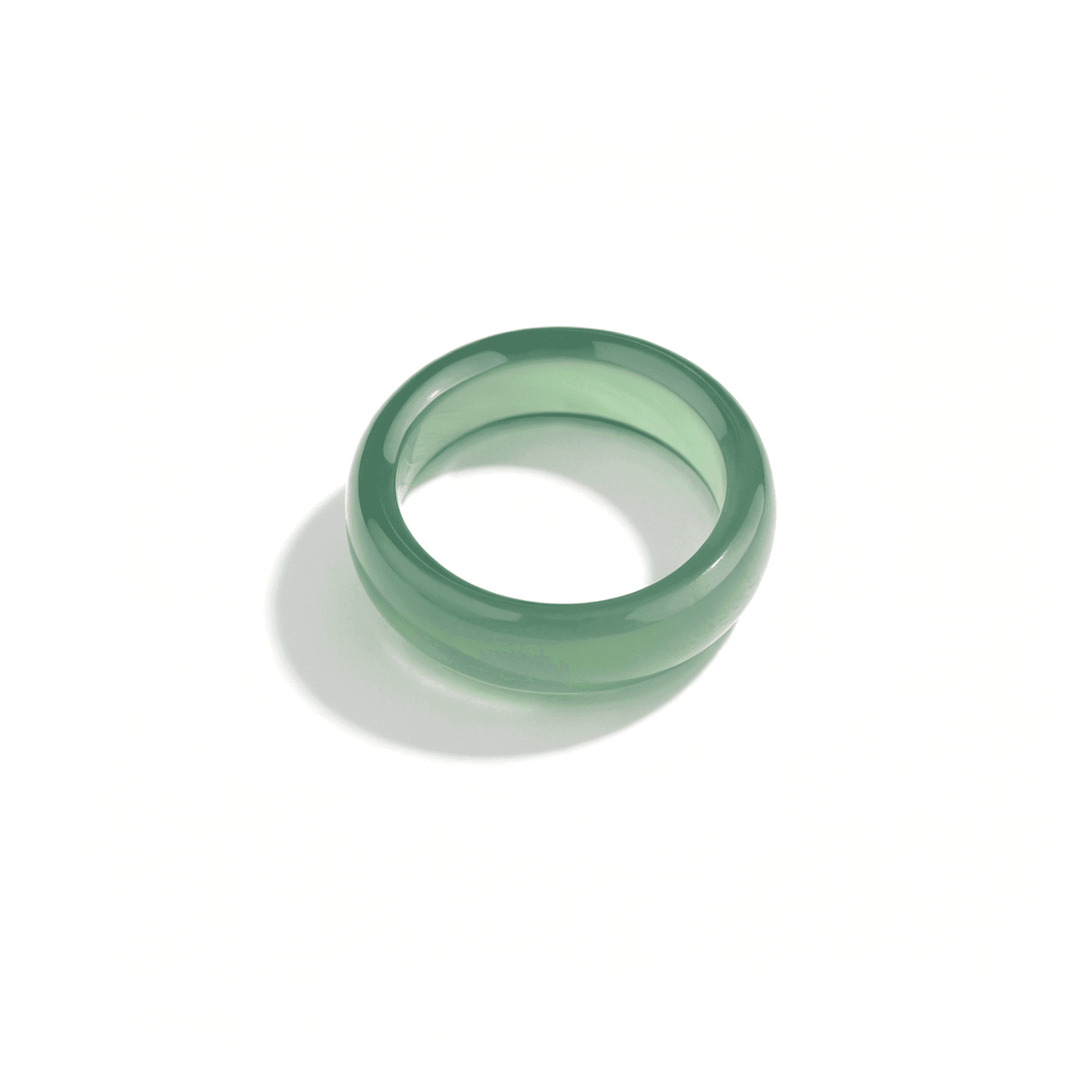 Detailed view of a forest green agate band, showcasing the deep "oily" emerald hue of high-quality natural chalcedony.