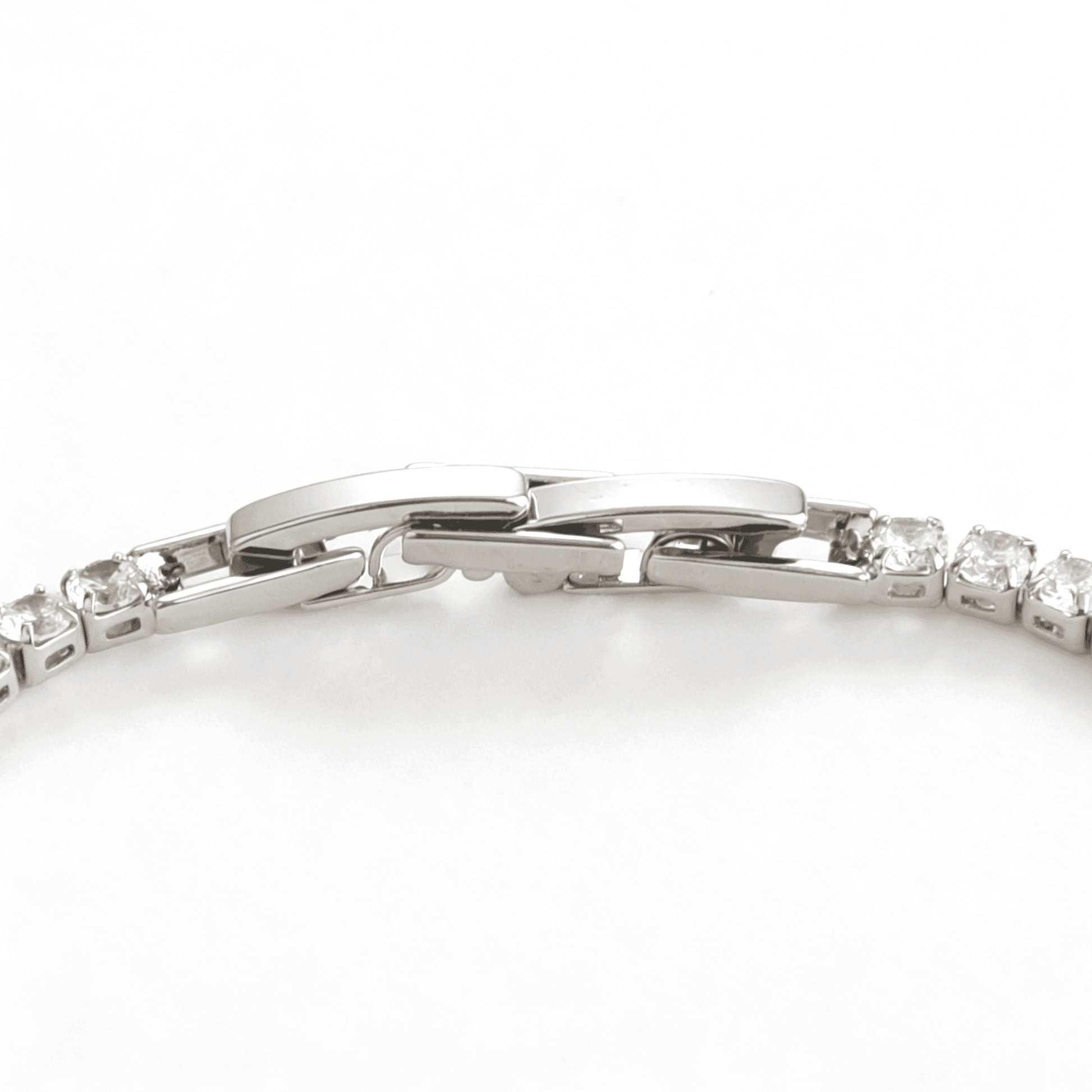 Detailed profile of the stackable silver bracelet, defining independent luxury and modern poise.