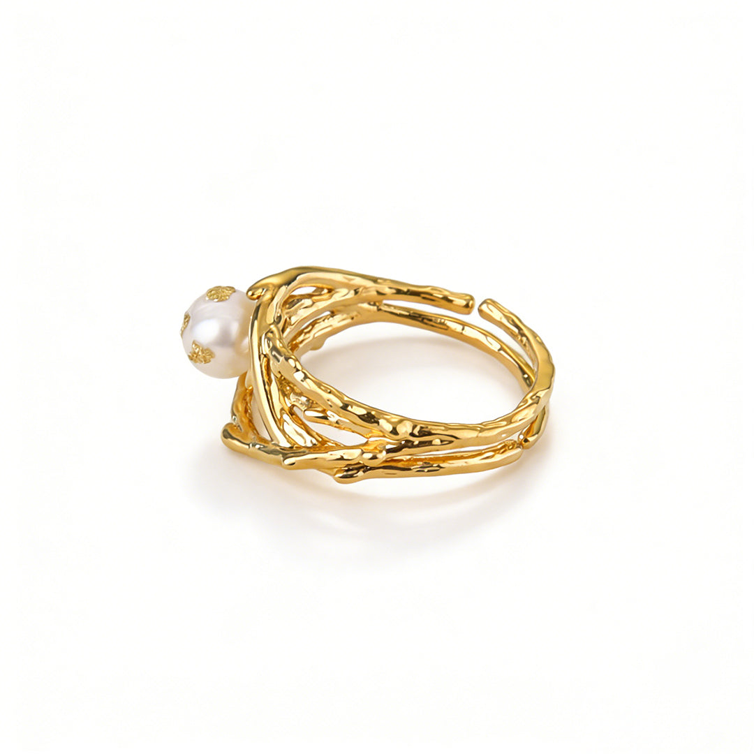Ever P. gold pearl rings with an adjustable open band, combining bird nest aesthetics with wire wrap art.