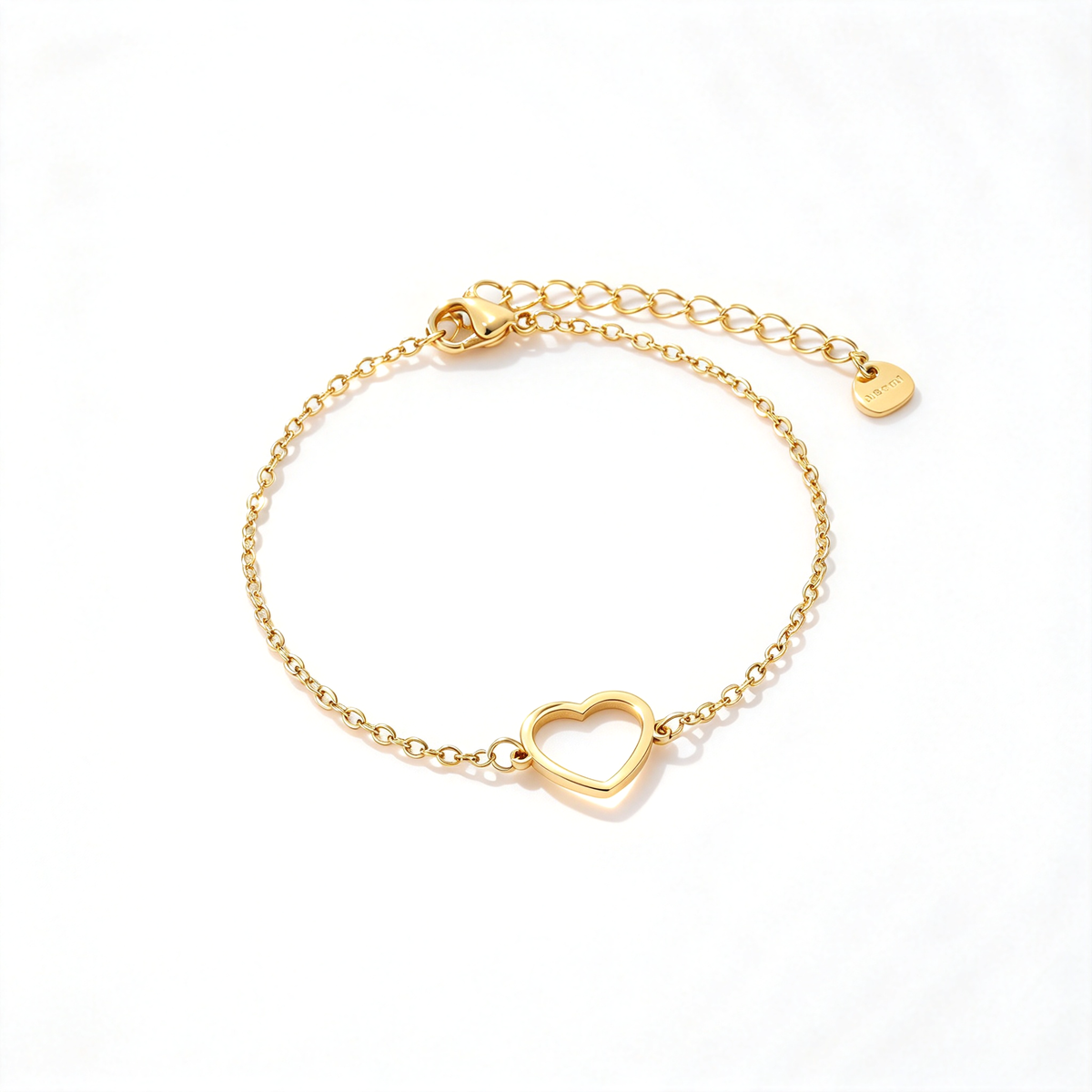Gold heart charm chain bracelet arranged on a clean white background