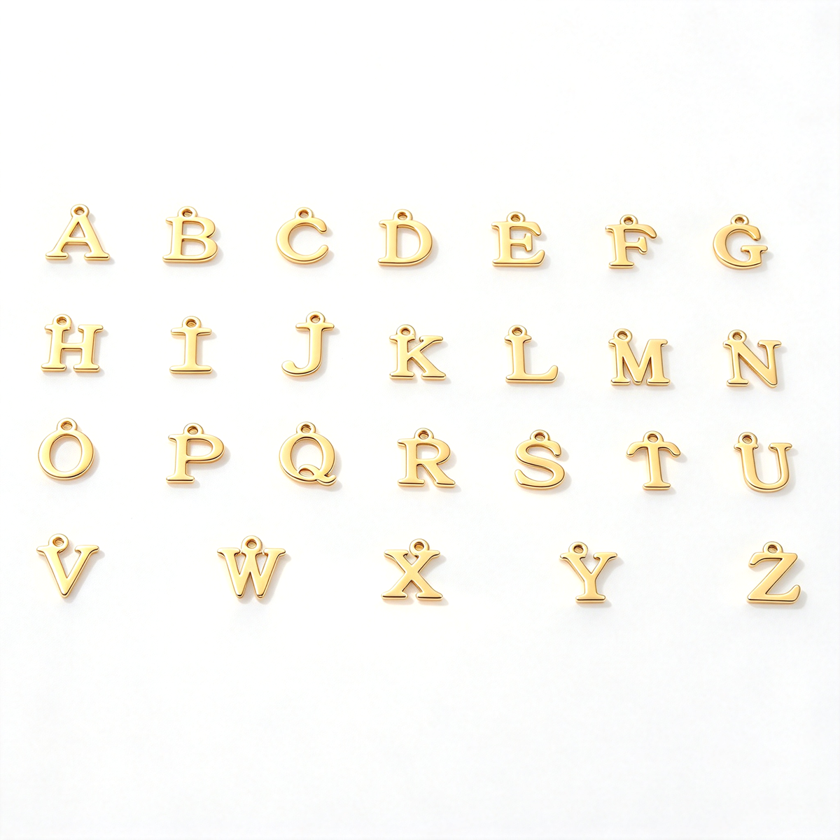 Alphabet charm options arranged in rows, showing the available initial designs for personalization.