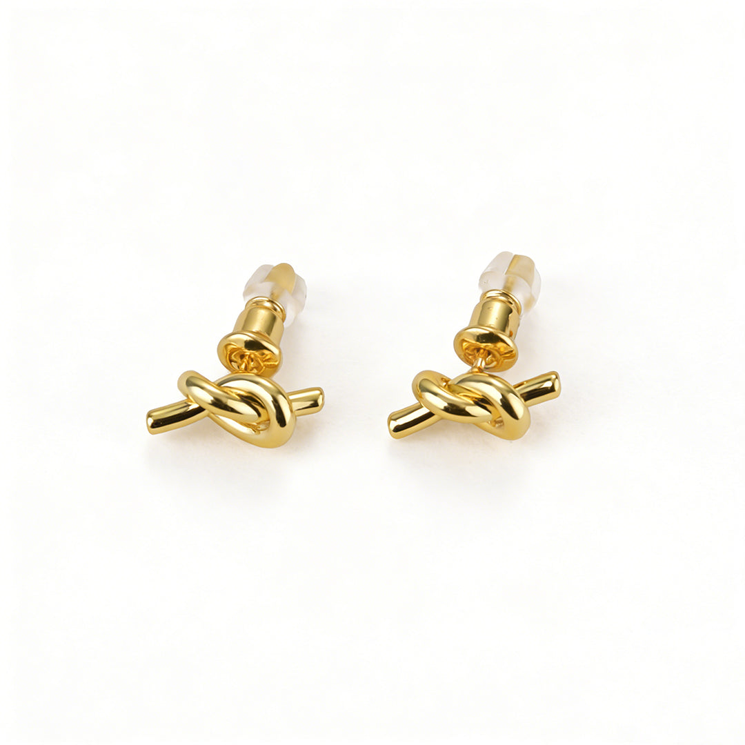 Elegant knot stud earrings from Ever P., highlighting the unique organic texture and radiant glow.