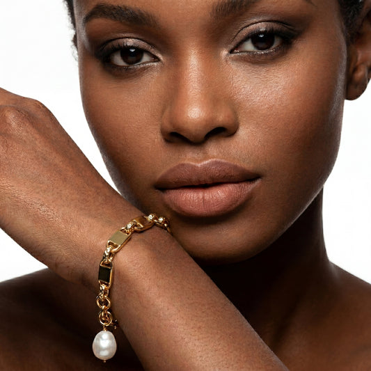 Ever P. tarnish-free gold bar chain bracelet with baroque pearl pendant on model.