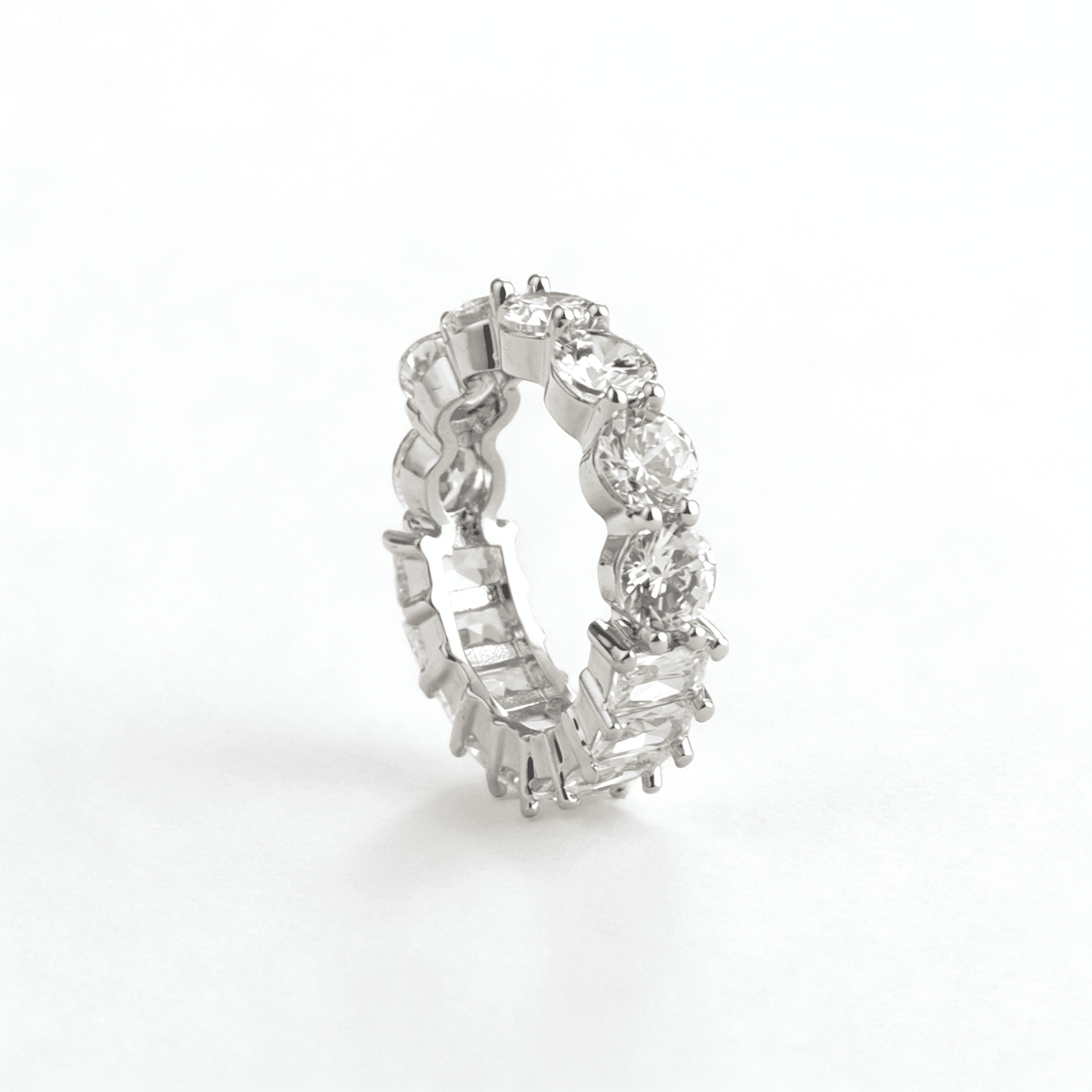 Ever P. mixed-cut eternity band featuring brilliant round and geometric baguette cubic zirconia on a luxury silver-plated copper base.
