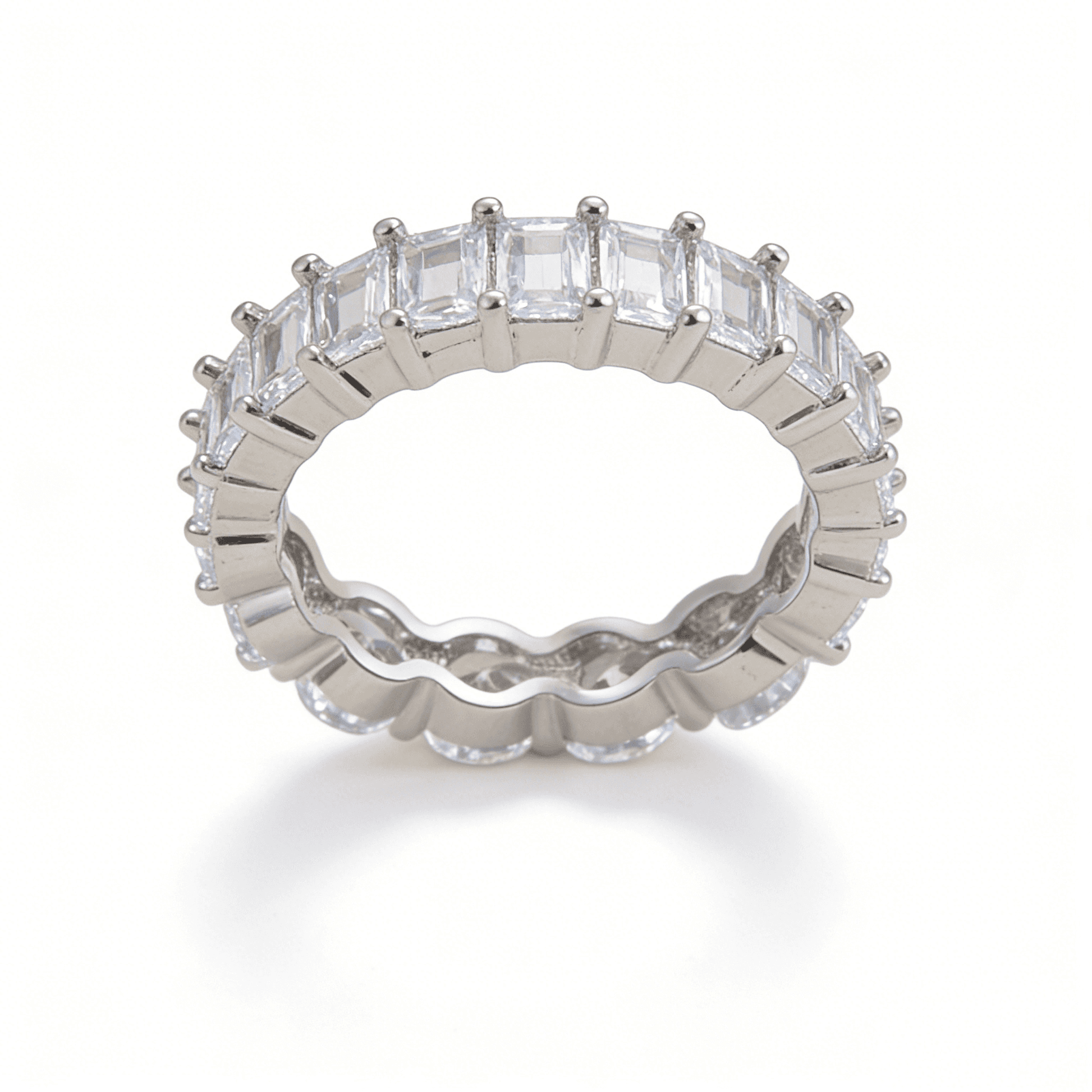 Detailed angled shot of the baguette-cut half of the Ever P. eternity ring, highlighting its clean architectural lines and independent luxury style.