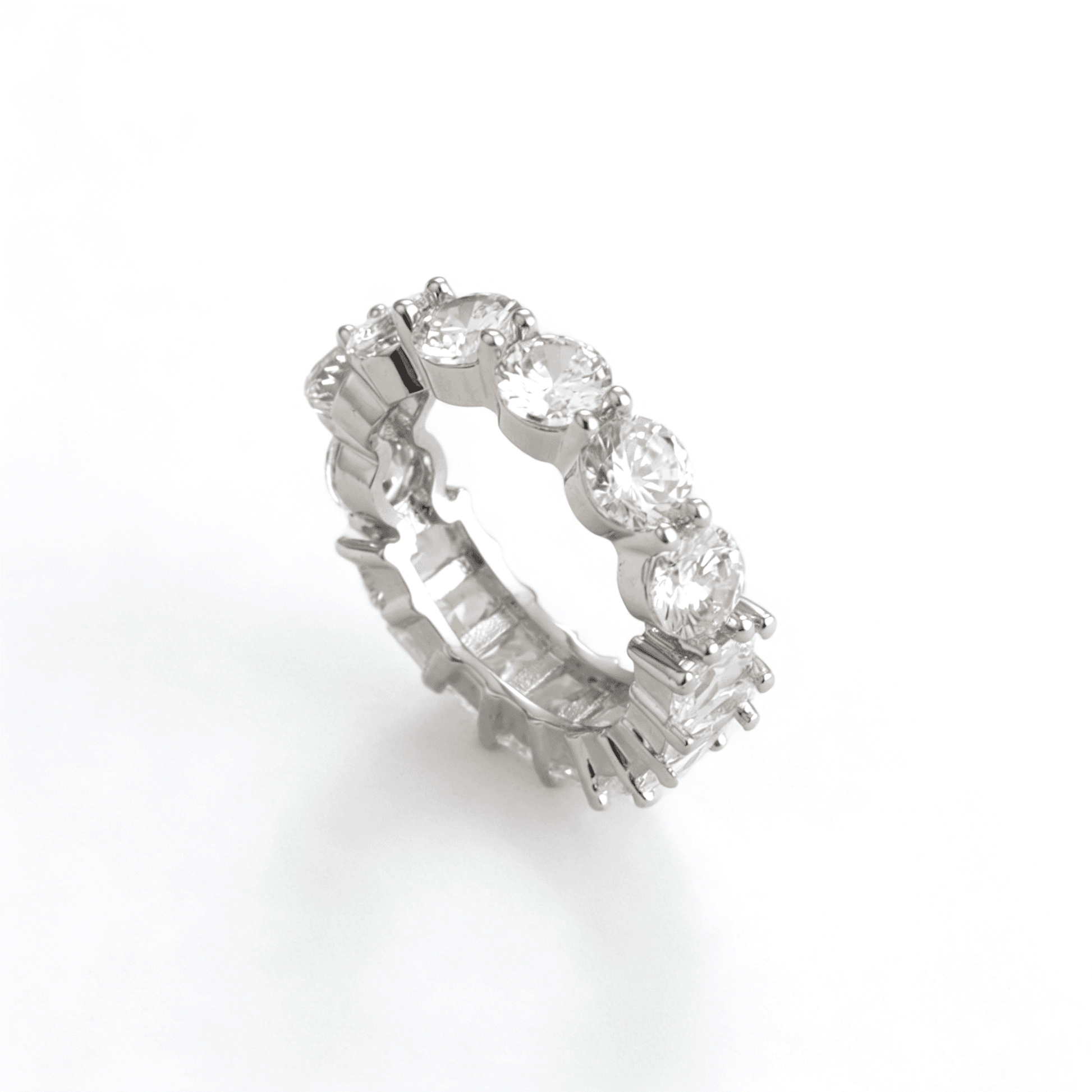 Close-up of the round-cut cubic zirconia side of the eternity band, capturing maximum fire and brilliance for a sophisticated travel ring choice.
