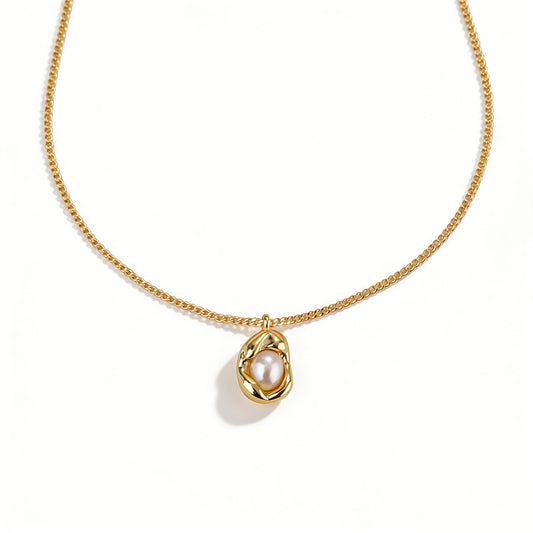 Ever P. natural pearl necklace featuring a golden pea pod pendant design.