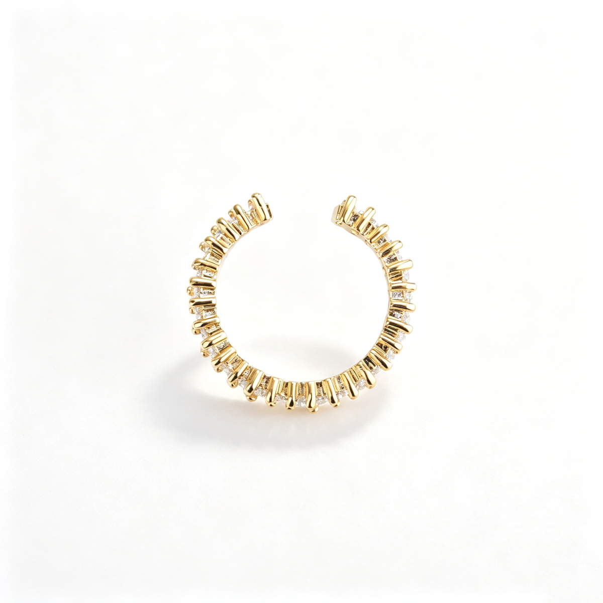 Open cuff bracelet with repeating geometric accents in a front view