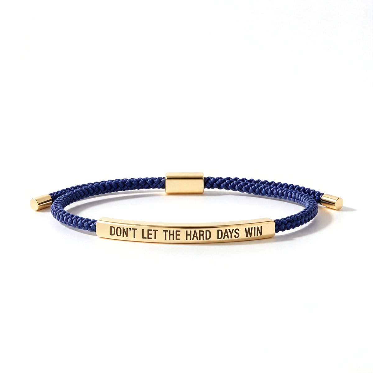 Green braided rope bracelet shown from the front with a silver-tone message bar and matching end caps.