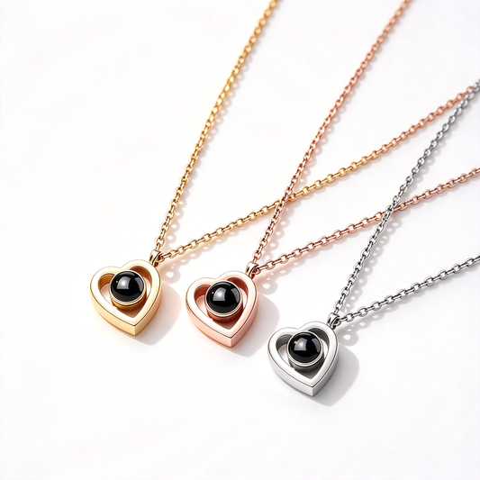 Custom pet photo projection heart necklaces in gold, rose gold, and silver tones arranged together on a white background.