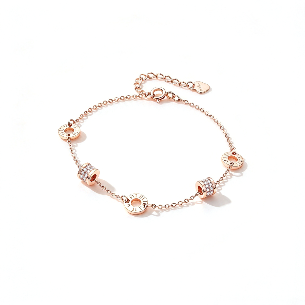 Rose gold-tone bracelet shown at an angled view, highlighting its linked chain and circular charms.